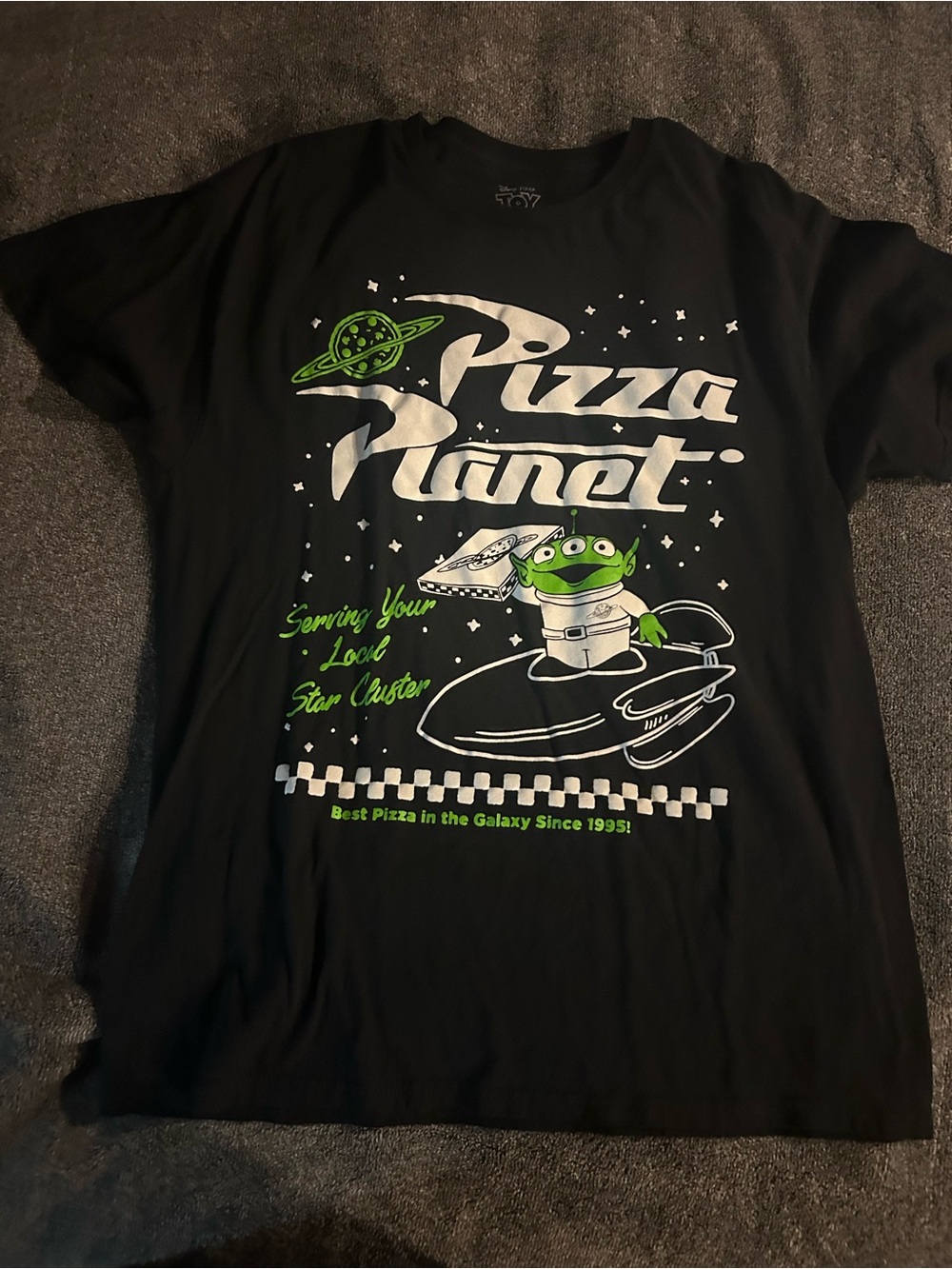 Disney Black Graphic Tee with Green and White Pizza Planet Design